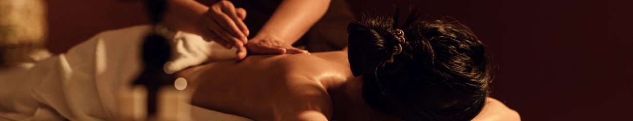 Relaxation woman back massage with masseur in cosmetology spa centre. Relaxation woman back massage with masseur in cosmetology spa centre. Relaxing female customer get service aromatherapy massage with masseuse in spa salon. Selective focus.